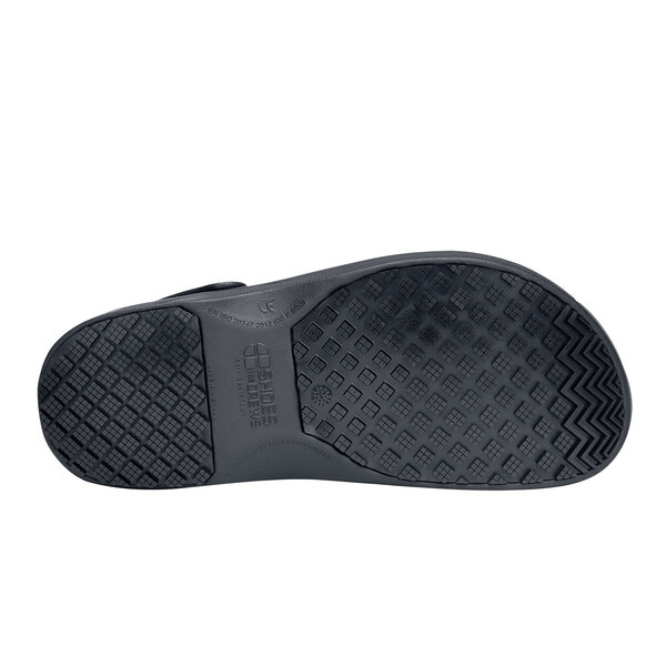 The bottom of a black Shoes For Crews Zinc casual shoe.