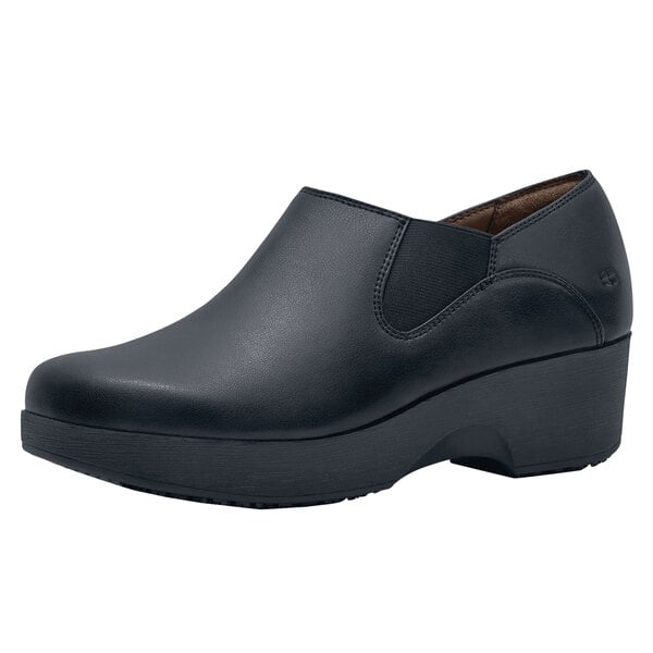 A black leather women's Shoes For Crews Kelsey shoe with a rubber sole.
