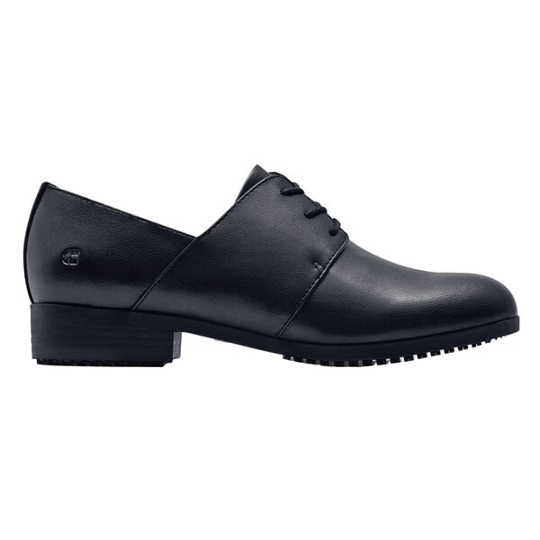 A black Shoes For Crews Madison III women's dress shoe with a leather sole.