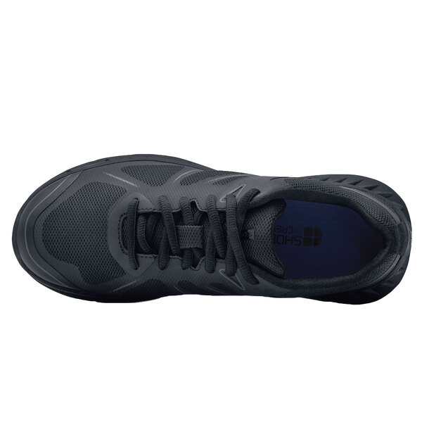 The back of a black Shoes For Crews Vitality II athletic shoe with a lace.