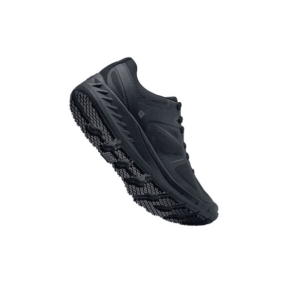 A close-up of a black Shoes For Crews Vitality II women's athletic shoe with a white sole.
