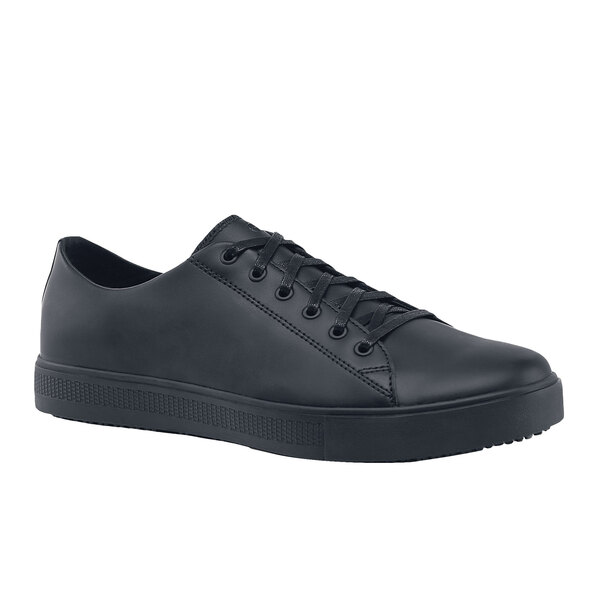A black leather Shoes For Crews men's casual shoe with laces and a rubber outsole.