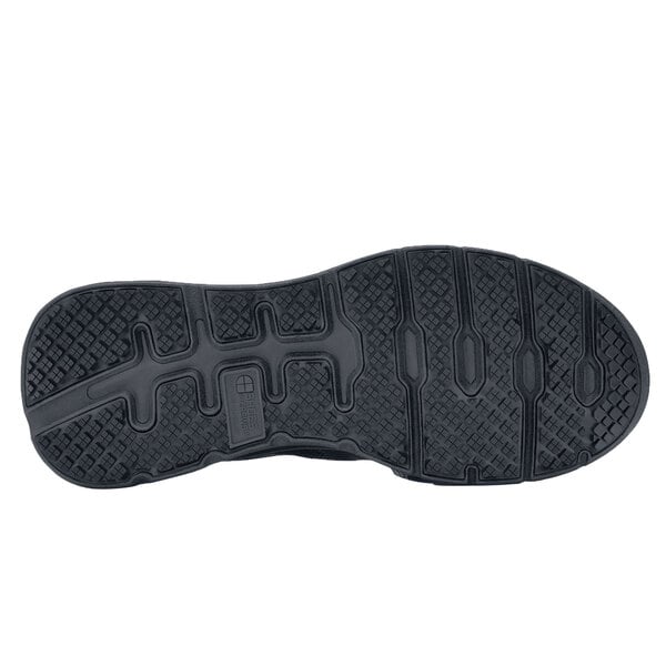 The black rubber sole of a Shoes For Crews Vitality II women's shoe.