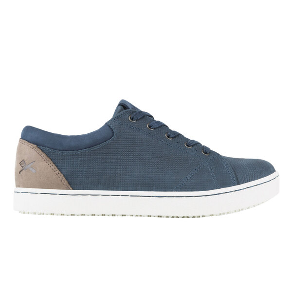 A blue and taupe Mozo women's casual shoe with a white sole.