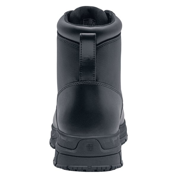 A black Shoes For Crews work boot with a zipper on the side.