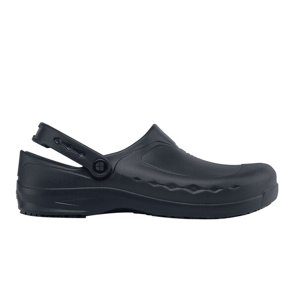 A black shoe with a velcro strap.