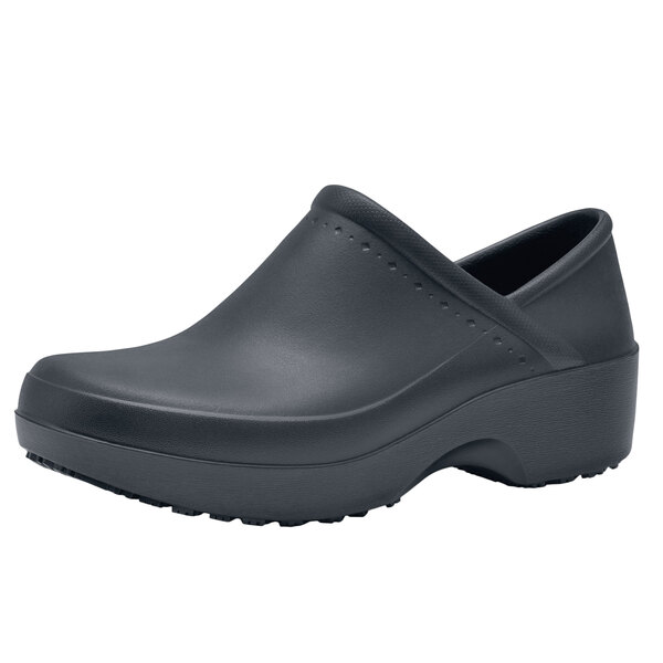 A black Shoes For Crews women's clog shoe with rubber soles.