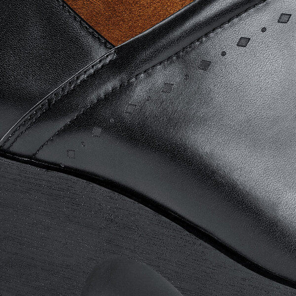 a close up of a black shoe