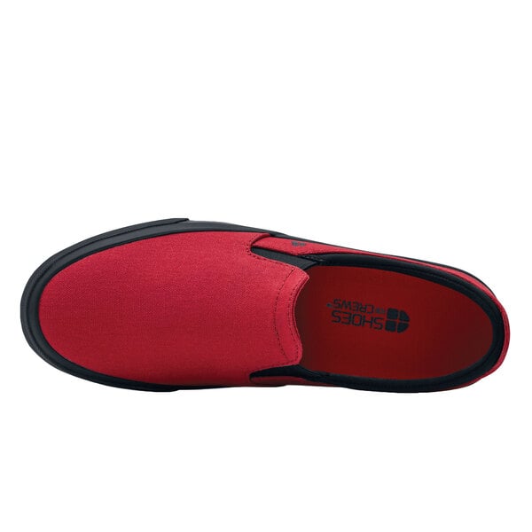 A red and black Shoes For Crews Ollie II men's water-resistant canvas shoe.