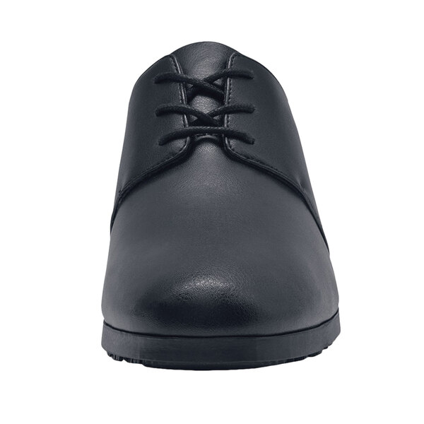 A black leather Shoes For Crews Madison III women's dress shoe with laces.