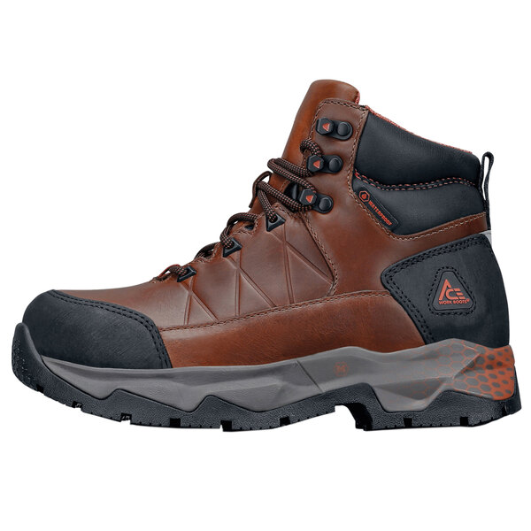 A brown waterproof work boot with peach accents and an aluminum toe.