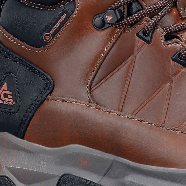 A brown and peach Highline work boot with a logo on the side.