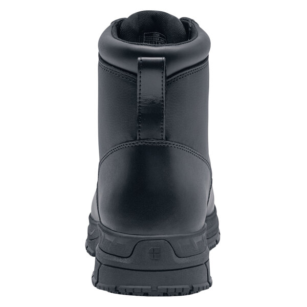 A black Shoes For Crews work boot with a zipper on the side.