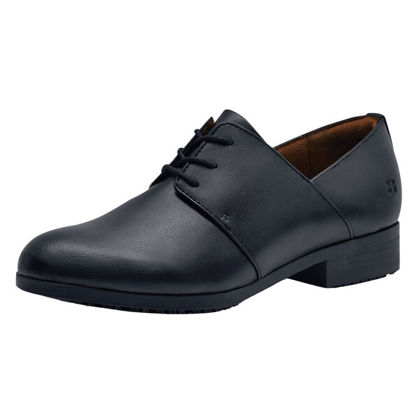 A black Shoes For Crews Madison III women's wide width dress shoe with laces.