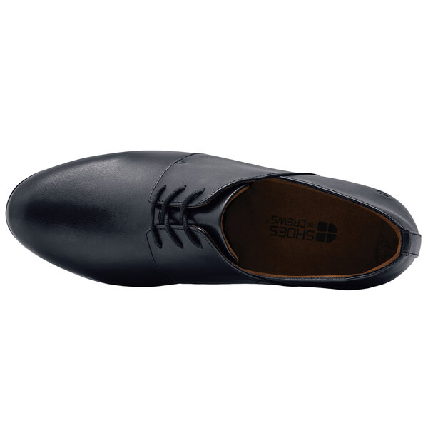 A black Shoes For Crews Madison III women's dress shoe with laces.