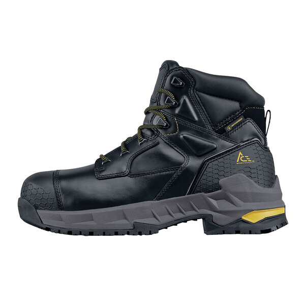 a black boot with yellow laces