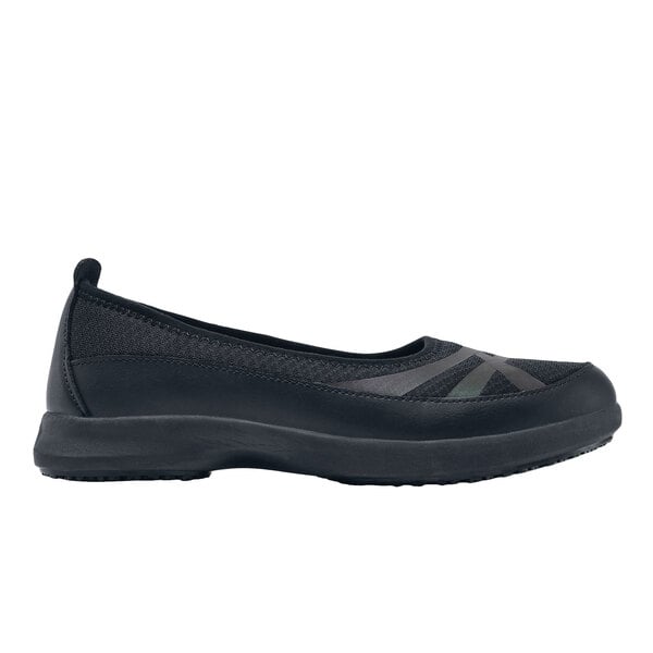 A black slip on Shoes For Crews Yogi shoe for women.