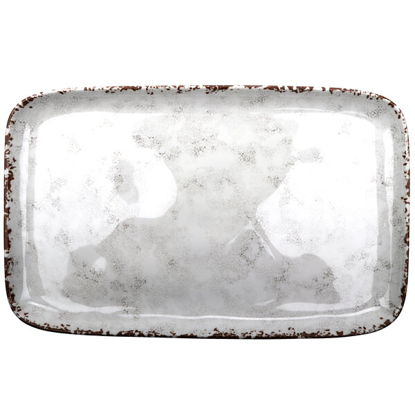a white rectangular object with brown border