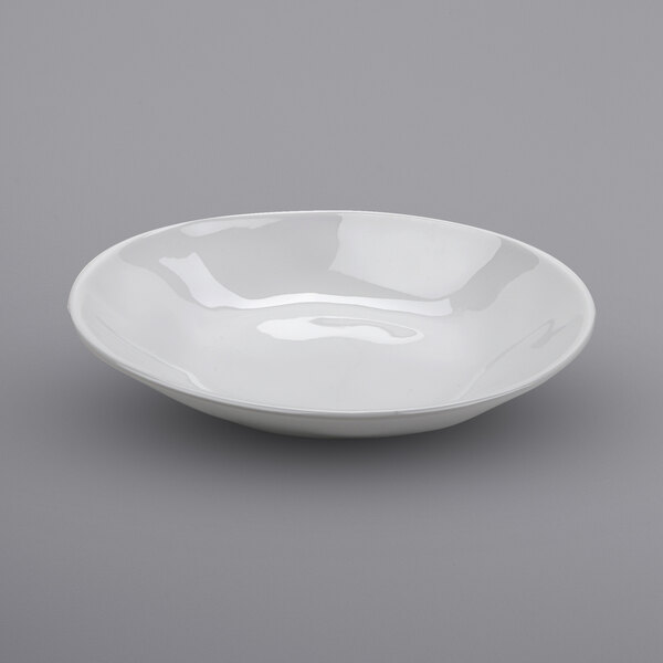 A white bowl on a gray surface.