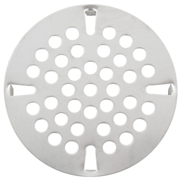 A circular metal strainer plate with holes in it.