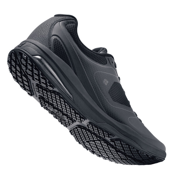 A black Shoes For Crews Evolution II athletic shoe.