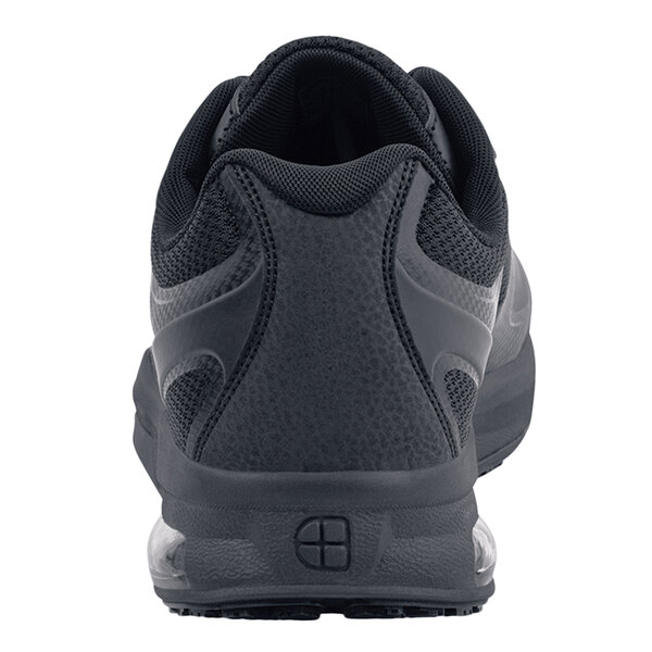 The back of a black Shoes For Crews Evolution II athletic shoe.