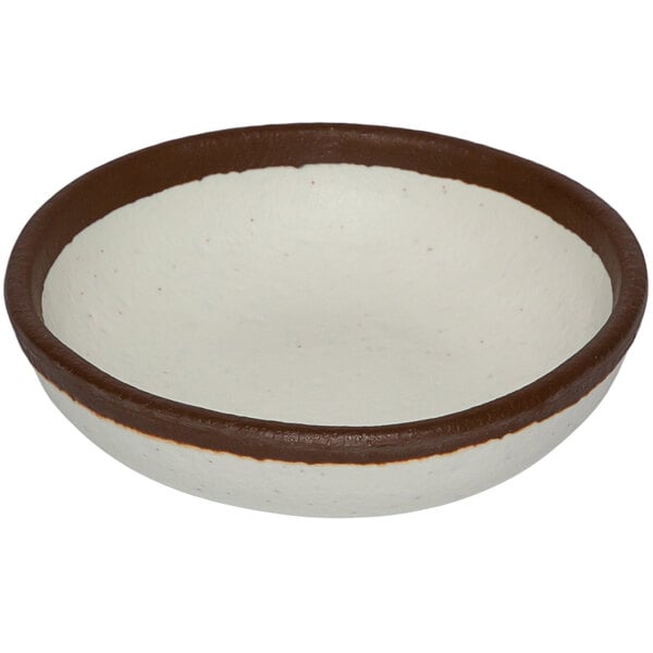 A white melamine ramekin with brown trim.