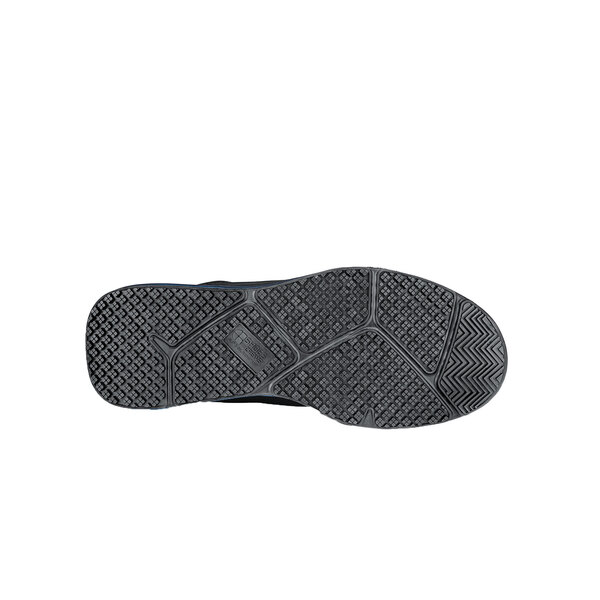 The black sole of a Shoes For Crews Tigon athletic shoe.