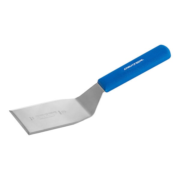 A Dexter-Russell blue plastic hamburger turner with a beveled edge and a handle.