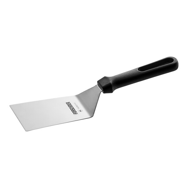 A Victorinox Flex High Heat Turner with a black handle.