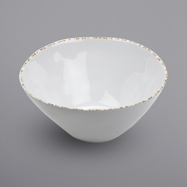 a white plate with gold trim