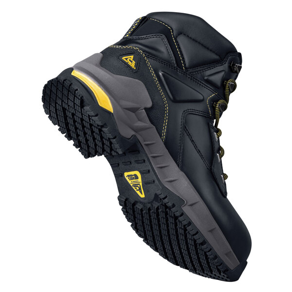 A black ACE Burren work boot with yellow accents on the sole.