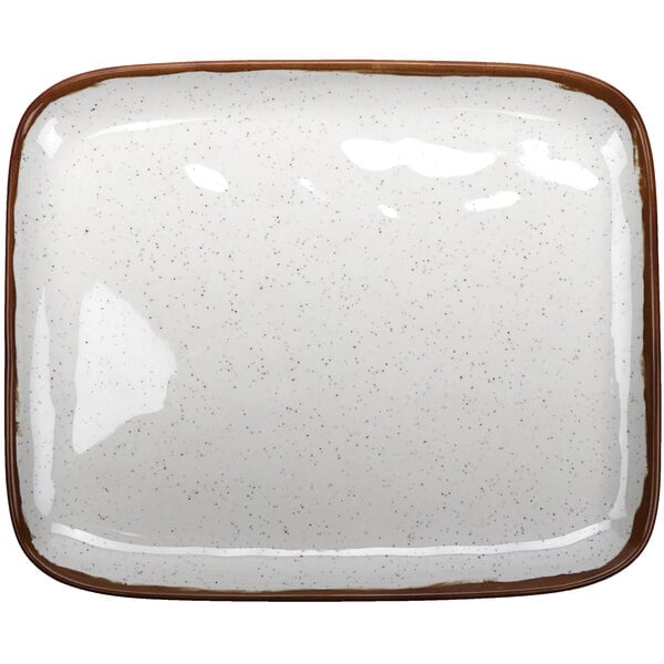 A white rectangular melamine platter with brown speckled edges.