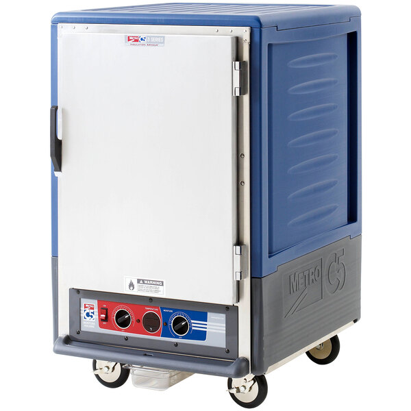 A blue and silver Metro C5 heated holding and proofing cabinet with wheels.