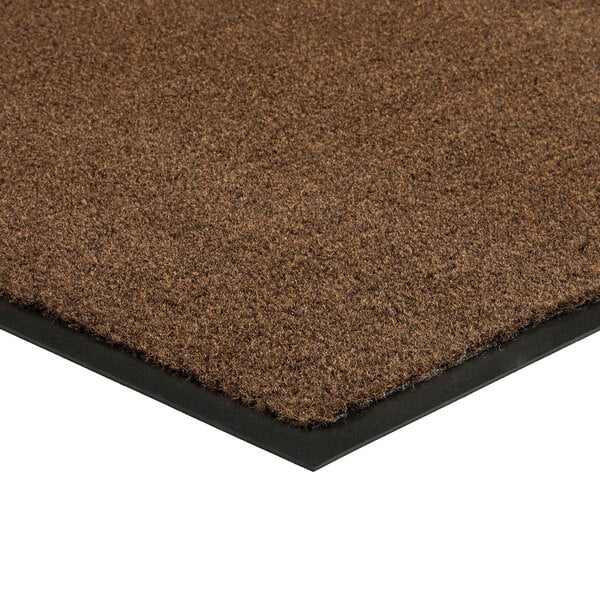 A light brown Lavex Olefin entrance mat with black rubber edges.