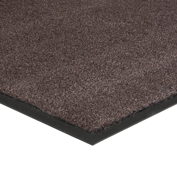 A close-up of a brown Lavex Olefin carpet mat with black rubber edges.