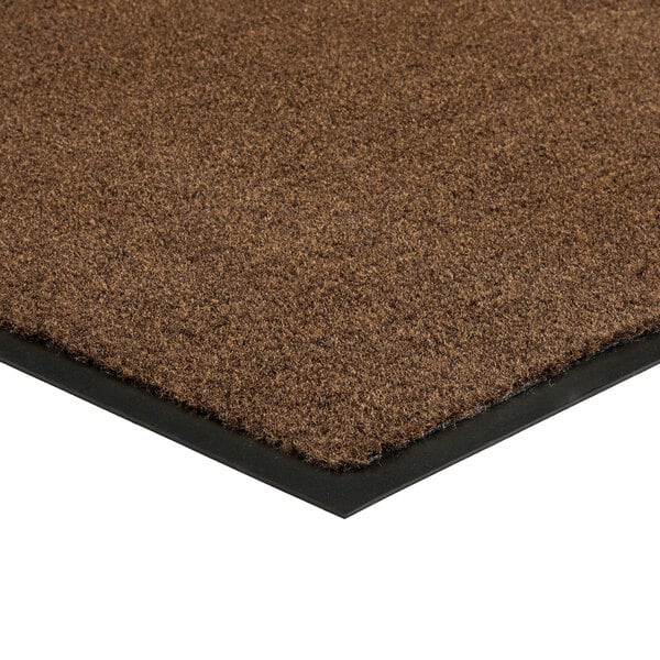 A light brown Lavex Olefin entrance mat with black rubber edges.