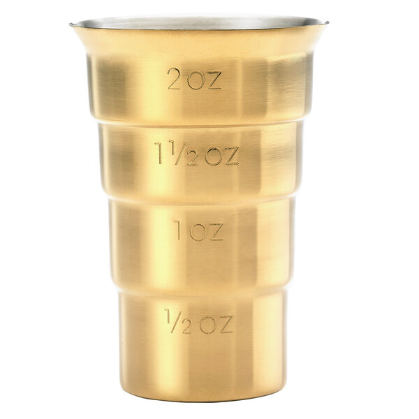 A gold-plated Barfly stepped jigger with measurements.