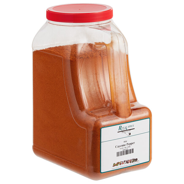 A container of Regal Mild Ground Cayenne Pepper on a white background.