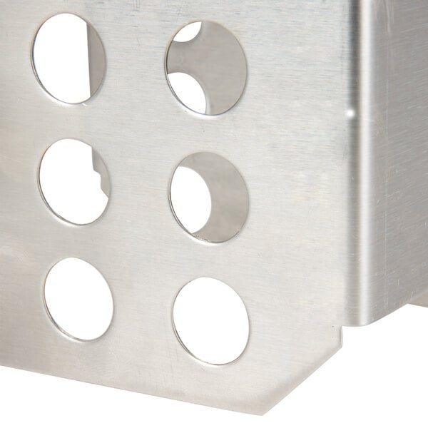 A metal box with a white circle and a hole in it.