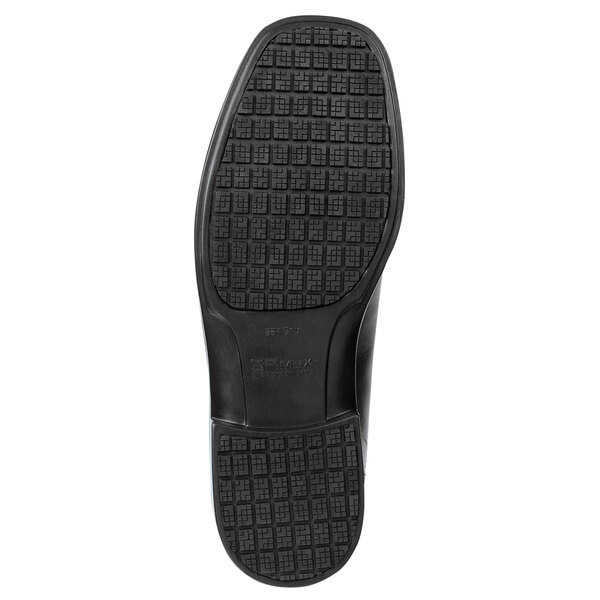 The black rubber sole of a SR Max Manhattan men's oxford dress shoe.