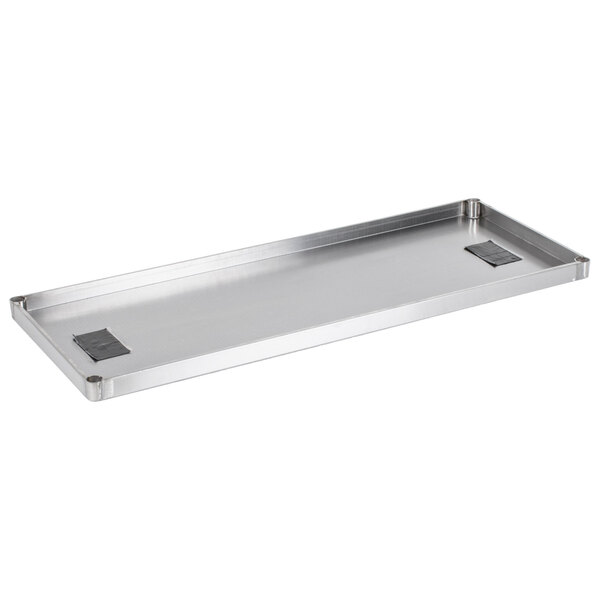 An Advance Tabco solid stainless steel shelf.