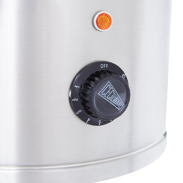 A close-up of a dial on a Grindmaster hot water boiler.