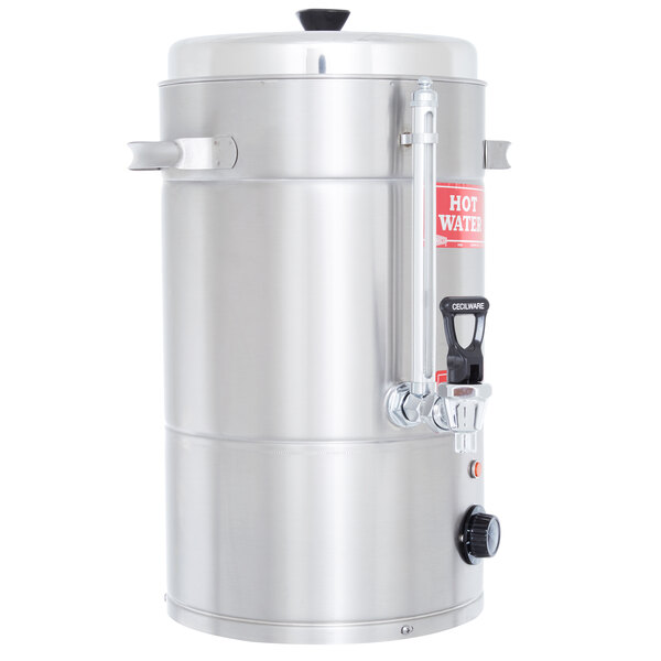 A stainless steel Grindmaster hot water boiler with a red label.
