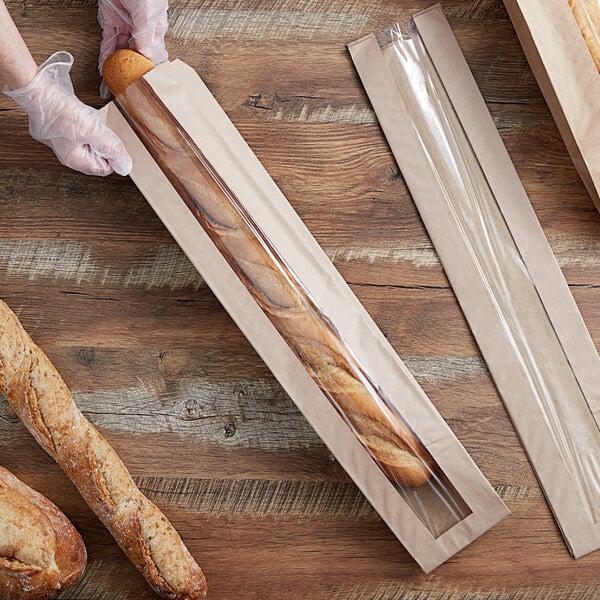 a person holding a baguette