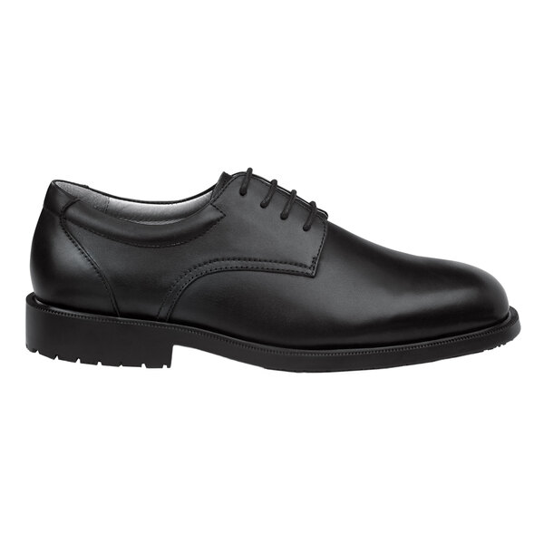 A black women's oxford dress shoe with a soft toe and non-slip sole.