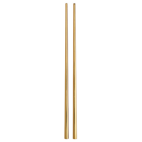 a pair of gold chopsticks