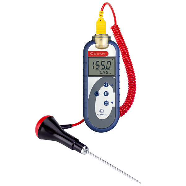 A Comark digital thermometer with a red cord and a needle attachment.