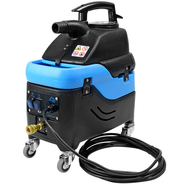 A blue and black Mytee Tempo upholstery spotter with a black cord.