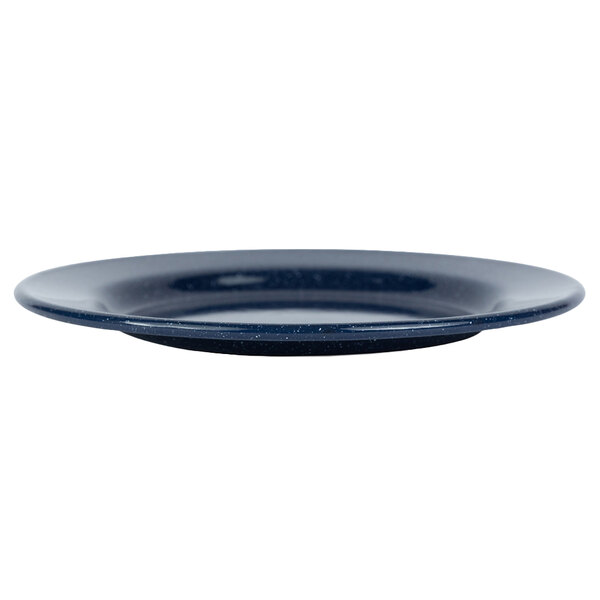 A close up of a Crow Canyon Home navy speckle enamelware salad plate with a rim.